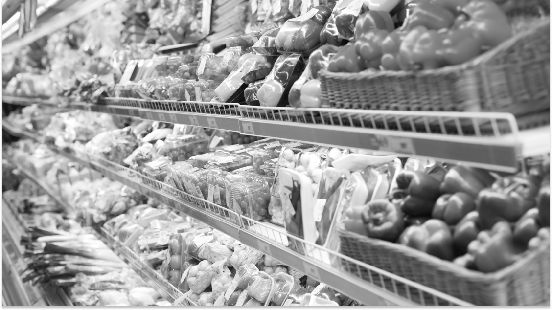 Supermarket shelves. Desaturated with colour filter from original and cropped.