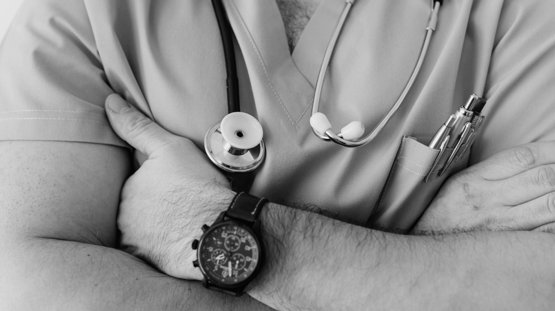 Crop unrecognizable male doctor with stethoscope